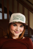 happiness grows here hat