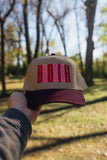 bookish maroon trucker hat