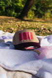 bookish maroon trucker hat