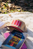 bookish maroon trucker hat